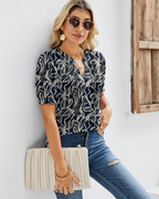 Hazel Top Donna – Bluse-tunika med blomsterprint, V-hals, puffermet ermer og folder